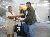Sharon Beharry, Library Assistant, Champs Fleurs campus, presents Raymond Law with the SBCS token.